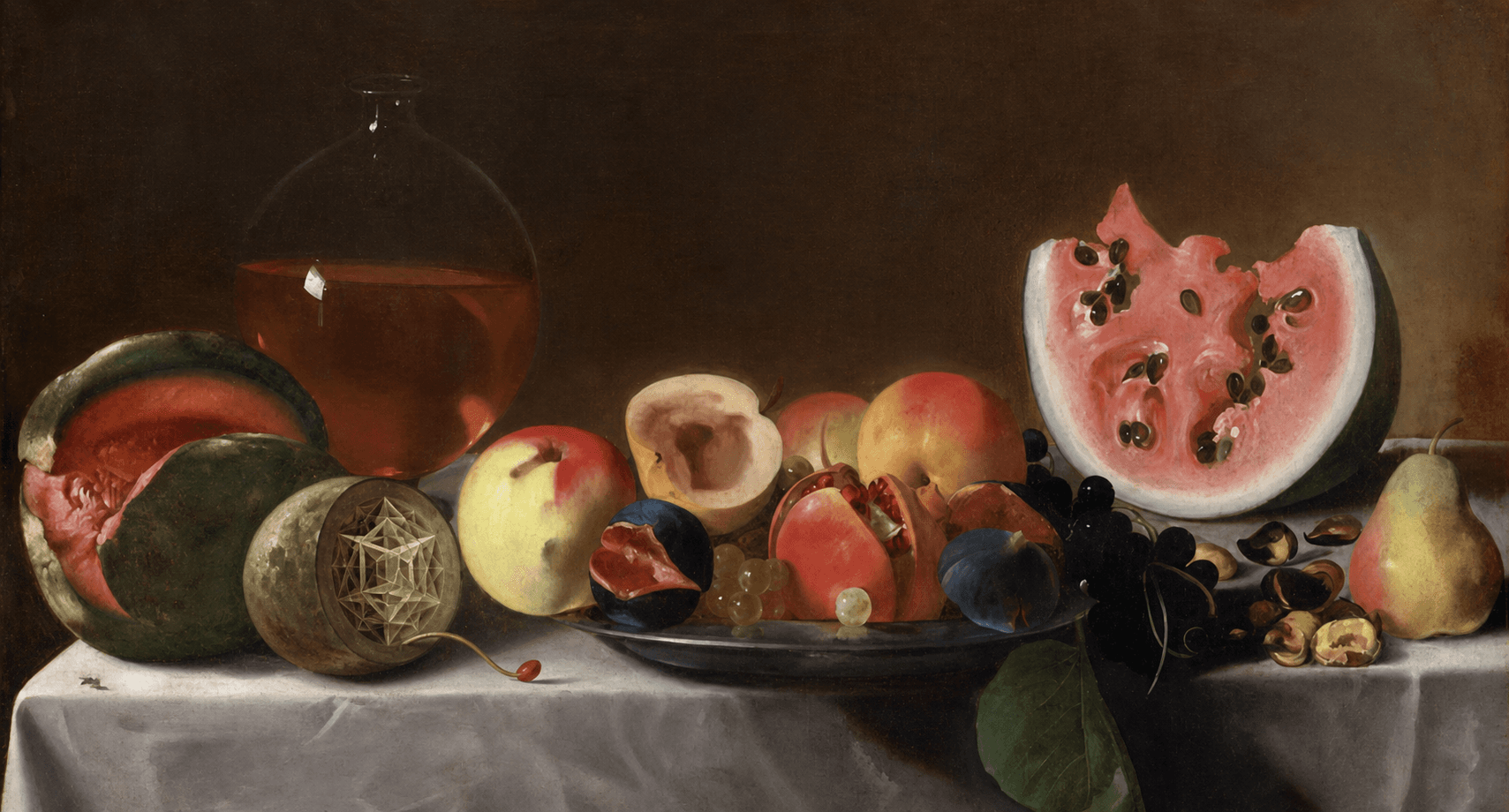 An old-master fruit still life with one cut fruit revealing a nested geometric structure